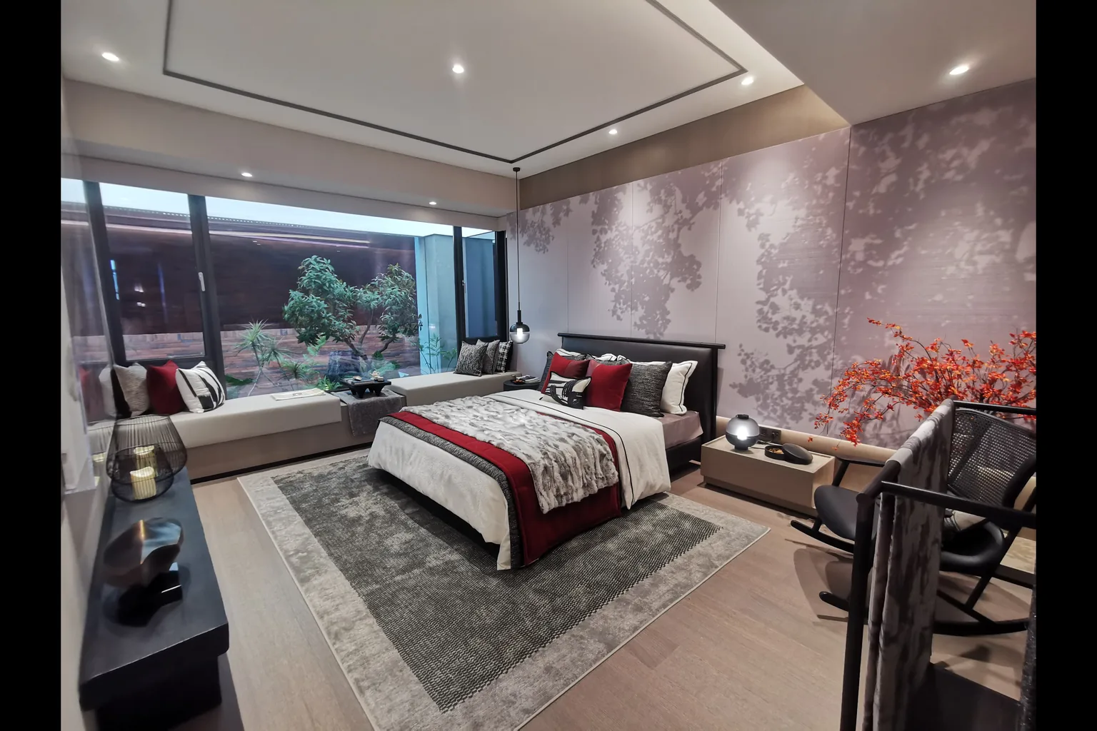 Bedroom with courtyard view, upholstered bed and coordinated soft furnishings
