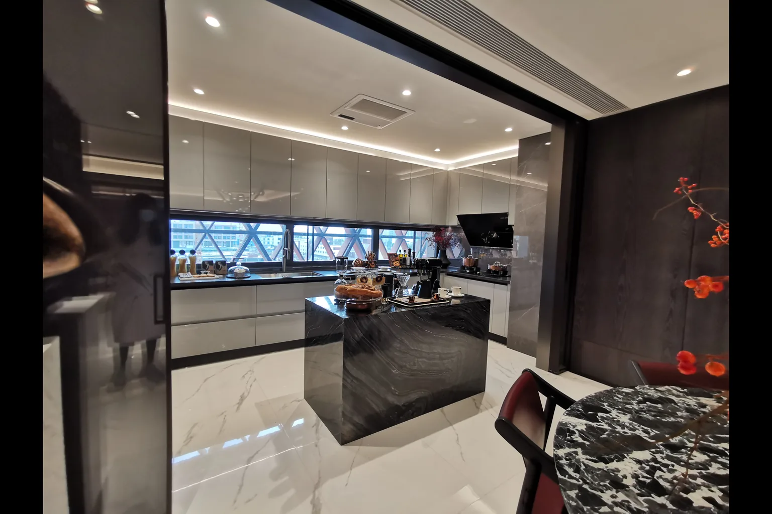 Kitchen island and countertop with light engineered-stone appearance