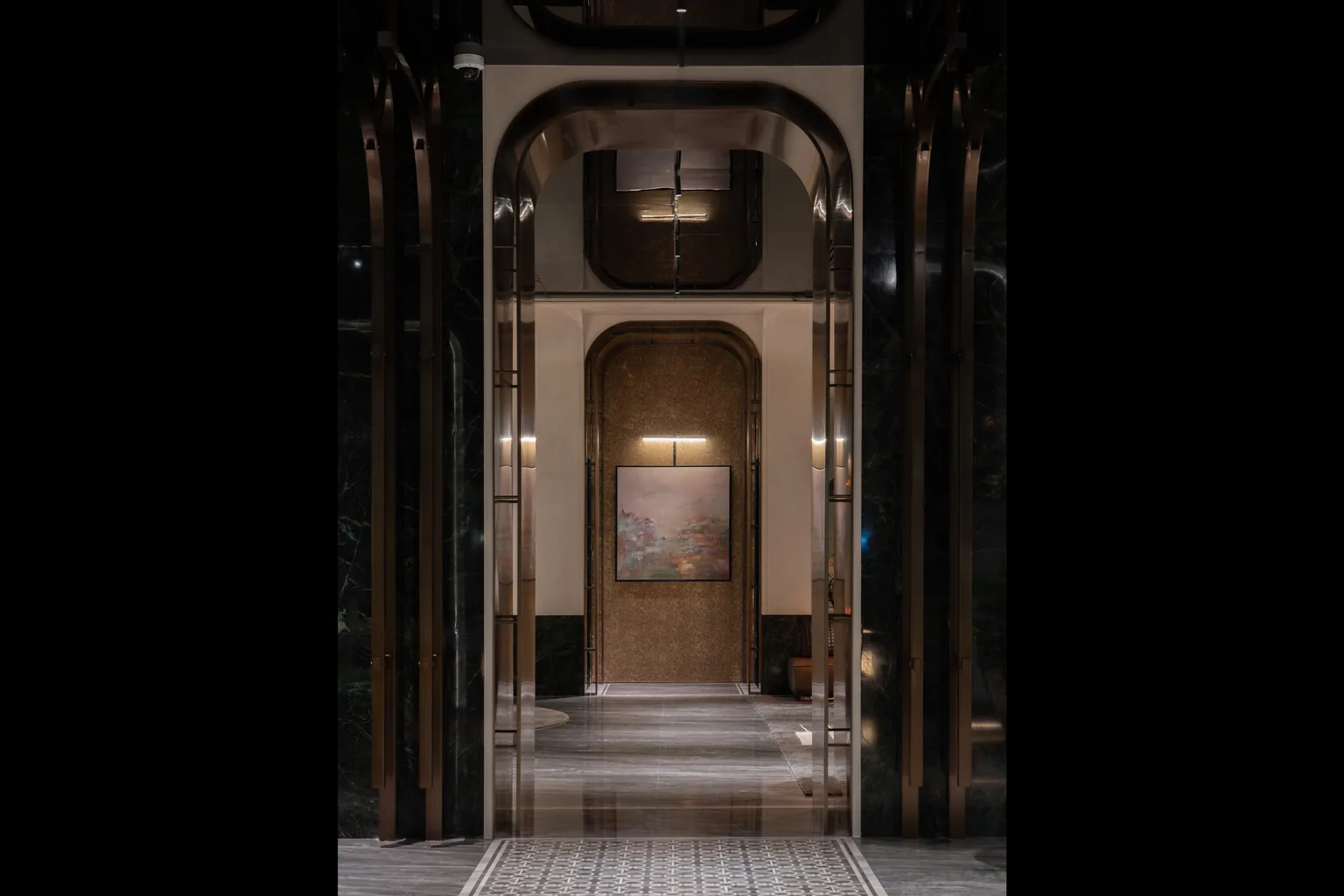 United Kingdom gym reception corridor with arched bronze metalwork