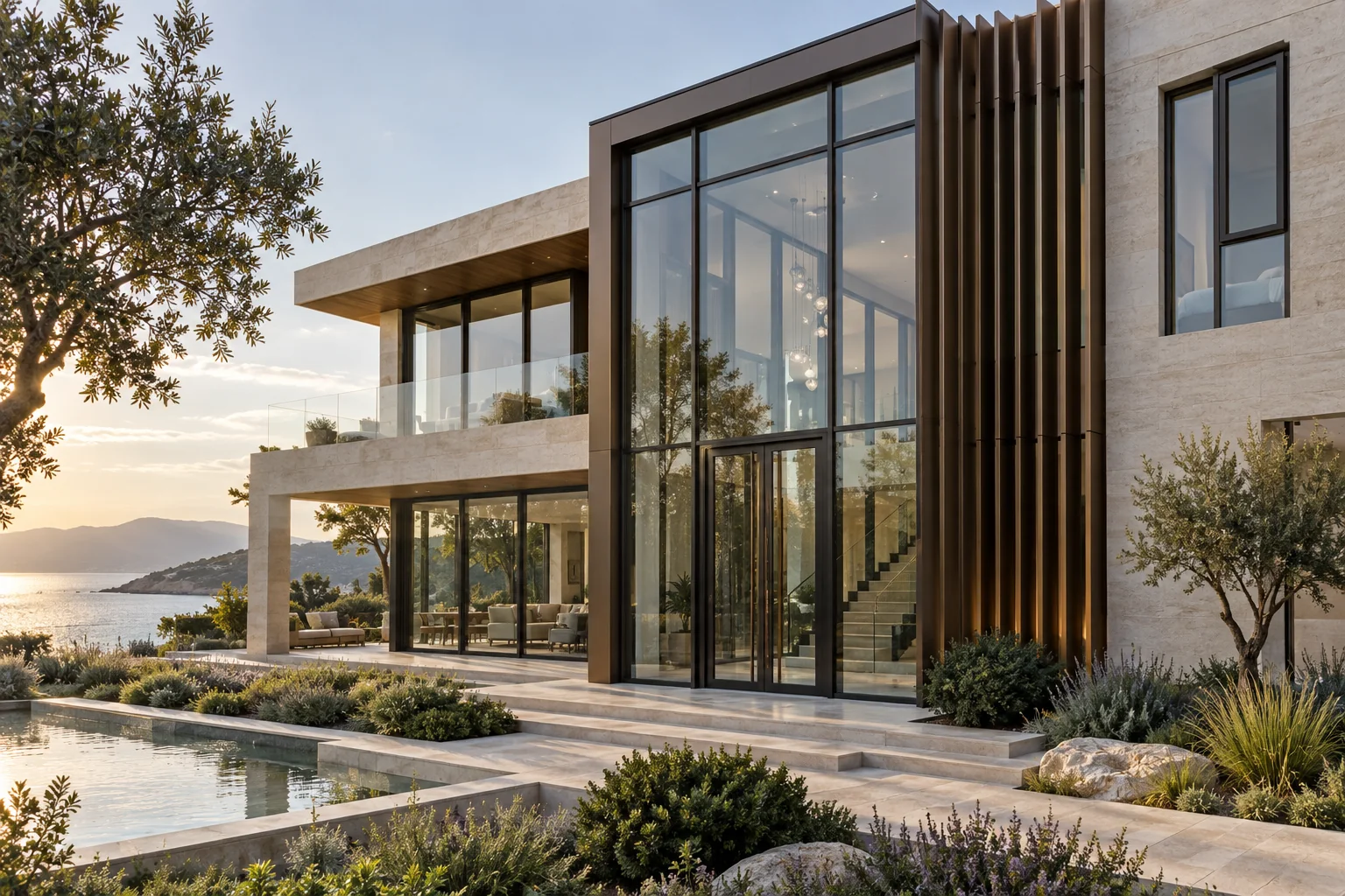 Contemporary coastal villa with double-height curtain-wall entrance and aluminum fins