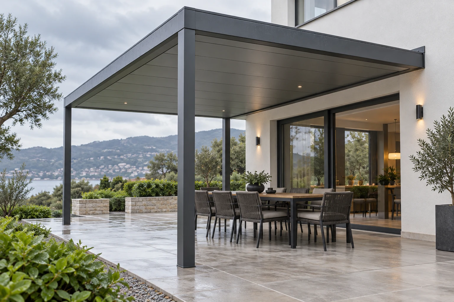Attached fixed-roof aluminum pergola after rain