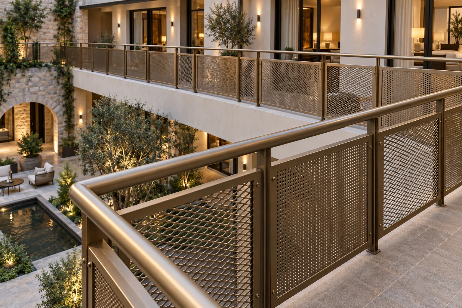 Bronze-toned framed metal mesh railing in a hotel courtyard