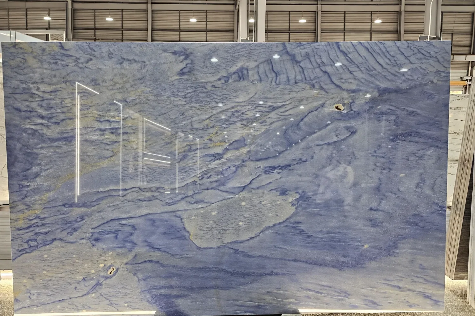 Blue-grey natural stone slab with flowing veining