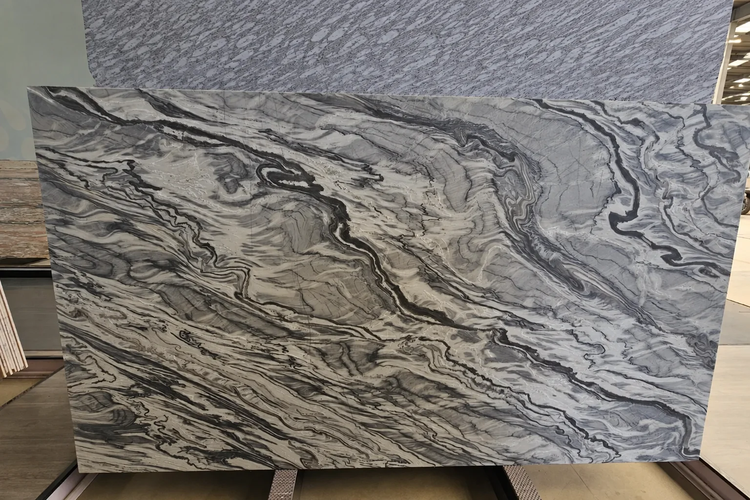 Grey natural stone slab with dense cloud-like movement
