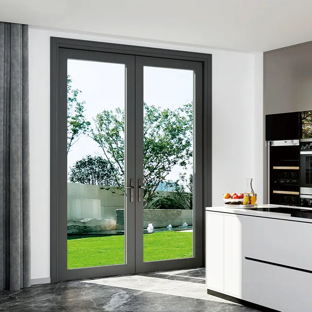 Dark aluminum French patio doors opening from a kitchen to a garden